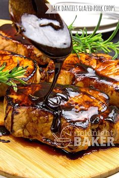 grilled pork chops with barbecue sauce on a cutting board