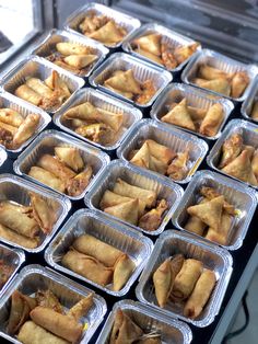 trays filled with food sitting on top of a table