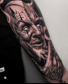 a man with a tattoo on his arm