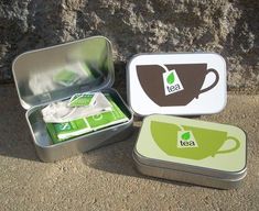 three tins with tea - to - go in an altodis tin on the ground