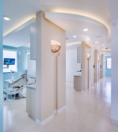 an empty dental room with lights on the ceiling