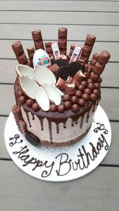 a birthday cake decorated with chocolate and marshmallows