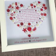 a white frame with red and white buttons in the shape of a heart