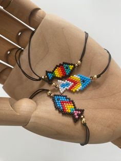 two beaded necklaces on a wooden chair