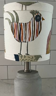 a table lamp with a bird design on it