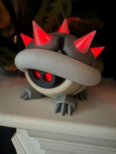 a toy with spikes on it sitting on top of a table