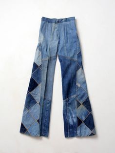 "This is a pair of Antonio Guiseppe designed jeans. The 1970s artist crafted jeans feature a diamond patchwork design of denim. The jeans have a high waist and flared leg. * Antonio Guiseppe * denim patchwork * bell bottoms CONDITION In very good condition. There are spots of faded tone and streaks - this is most likely part of the design. The legs are hemmed with a 1.5\" allowance. MARKED SIZE 28 MEASURED SIZE: 26 x 34 MEASUREMENTS Waist: 26\" ... 66 cm Inseam: 34\" ... 86.4 cm Hips: 33\" ... 8 Upcycled Overalls, Denim Repurpose, Designed Jeans, Quilt Clothing, Refashion Jeans, Patchwork Denim Jeans, Quilted Clothing, Patchwork Clothing, 70s Denim