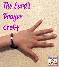 a child's hand with the words, the lord's prayer craft