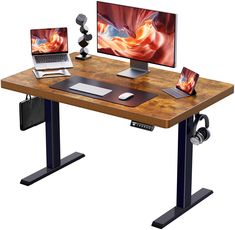 a computer desk with two computers on it