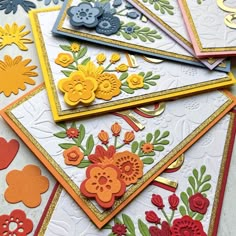 a pile of cards that have flowers on them