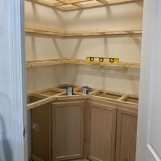 the kitchen cabinets are being built and ready to be installed on the wall in the pantry