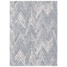 a gray and white rug with an abstract design