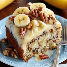 a piece of cake with bananas and pecans on top