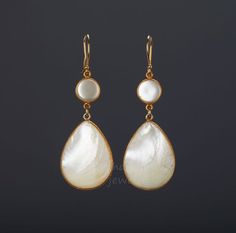 A pair of two tier natural Mother of Pearl set in gold vermail (gold lated over sterling silver) bezel:1. Stone : Mother of Pearl (natural gemstone)2. Stone shape and size:        top: round 11 mm across       bottom: pear 35 x 27 mm3. earring total length ~68 mm4. bezel material: sterling silver or gold vermail (gold over sterling silver)5. earring hook: sterling silver or gold vermail 6. an optional custom note card, printed with your personalized message on heavy weight cardstock, in elegant High Luster Drop Earrings, Gold Teardrop Pearl Earrings As A Gift, Gold Dangle Jewelry With High Luster, Gold Teardrop Pearl Earrings For Gift, Gold High-luster Dangle Jewelry, Elegant Mother Of Pearl Earrings As Gift, Elegant Yellow Gold Mother Of Pearl Earrings, Exquisite Gold Drop Earrings, Handmade Yellow Gold Mother Of Pearl Jewelry