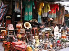 an outdoor market with lots of items for sale