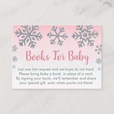 a pink and white book for baby card with snowflakes on the front, reads books for baby