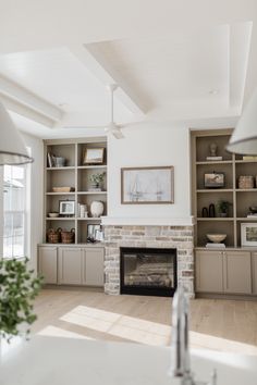 a living room filled with furniture and a fire place