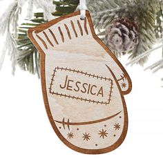 a wooden ornament hanging from a christmas tree