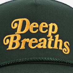 At Taft, we believe that mental wellness is foundational to living a fulfilling and balanced life. Our approach centers on four essential pillars: Mindfulness, Movement, Rest and Relaxation, and Social Connections.  The Deep Breath hat. Features an embroidered "Deep Breaths" message in gold, complete with an embroidered black heart side patch.   Details:   5 panel structured cap   Adjustable snapback   Braided rope detail  Made with a cotton/polyester blend front and polyester mesh back   One size fits most  10% of the proceeds will be donated to  Mental Health America. Gym Hats, Mad Hat, Silly Shirt, Patch Hats, Deep Breaths, Balanced Life, Kind Reminder, Shirt Print Design, Braided Rope