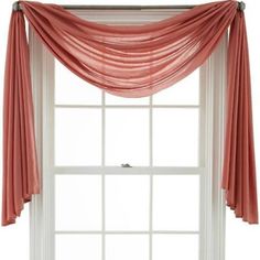 an open window with sheer curtains hanging from it