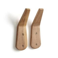 two wooden pegs on a white background