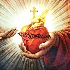 hands holding a heart with the cross above it