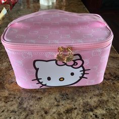 a hello kitty lunch box sitting on top of a counter