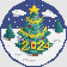 a cross stitch christmas tree on a snow covered ground in the shape of a circle