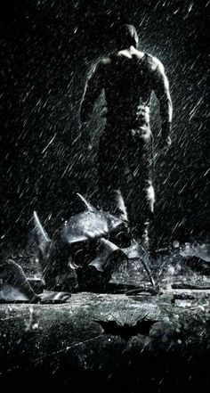 the dark knight rises movie poster with batman running in the rain and bats flying around