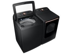 a black washer and dryer sitting side by side on top of each other