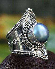 Fanciful and unusual this ring is covered with shining silver globes. They surround a dazzling blue Mabe pearl in a design with Indonesian elegance. It comes from Kadek Wijanegara in beautiful Bali. .925 Sterling silver Pearl Cocktail Ring, Jewelry Pearls, Pearl Jewelry Gift, Mabe Pearl, Bohemian Design, Silver Work, Handmade Rings, Pearl Types, Lovely Ring