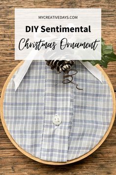 a christmas ornament with pine cones on it and the words diy sentimental christmas ornaments