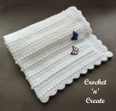 a crocheted placemat with two butterflies on it