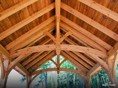 King post trusses with arched braces create visual interest in the Teton Timber Frame Pavilion. This pavilion is 14' x 24', and provides shade for a seating area on a lake. #thebarnyard #thebarnyardstore #timberframepavilion #timberframepavilions #mortiseandtenon #postandbeam #authenticjoinery #joinery #timberframe #timberframing #oakpegs #pavilion #pavilions #exceptionallybuilt #teton #tetonpavilion #kingposttruss #trusses #timbertruss #tby52240 King Post Truss, Vinyl Cladding, Timber Frame Pavilion, Timber Frame Joinery, Timber Truss, Exposed Rafters, Timber Frame Construction, Pavilion Design, Architectural Shingles