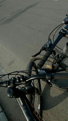 a bicycle is parked on the side of the road