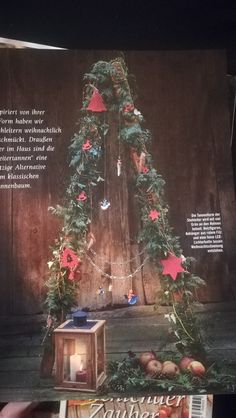 an open magazine with christmas decorations on it