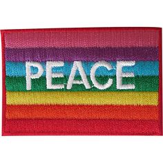 a patch with the word peace on it in white letters and multicolored stripes