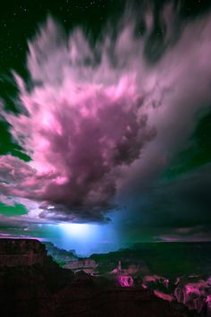 a lightning storm is seen over the grand canyon