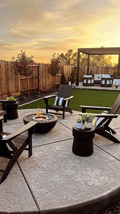 an outdoor patio with chairs and fire pit