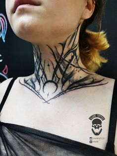 a woman with a tattoo on her neck