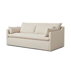 a white couch with two pillows on it