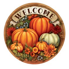 a welcome sign with pumpkins and flowers