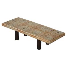 a wooden bench made out of tile with black legs