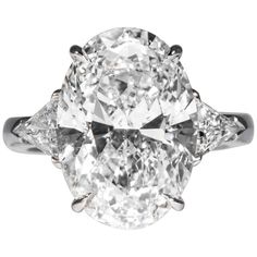 an oval cut diamond ring with three side stones