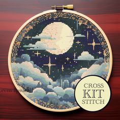 cross - stitch kit with the moon and clouds