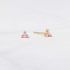 Tiny 3 Stone Studs. Perfect for cartilage or multiple piercings. Dainty and minimalist, but adds a nice touch!   DETAILS  * Thick plating of 14k Gold, Rhodium, or Rose Gold over 925 Sterling Silver * 3.5mm x 3.5 mm  * Sold as a Pair * Hypoallergenic and nickel-free  * Also available in white cz, emerald, sapphire, or a light pink cz stone ♥︎ ♥︎ ♥︎ Model Details ♥︎ ♥︎ ♥︎ 2nd Hole- (2mm size) https://www.etsy.com/listing/1154500077/tiny-ball-stud-earrings-ball-studs-stud?click_key=772e6d7f7021c5b7e72d2c2498531b61a0f21230%3A1154500077&click_sum=383bf1ac&ga_search_query=ball%2Bstuds&ref=shop_items_search_3&pro=1&sts=1 Made with 100% Pure Love ♥︎ Happy to answer any questions! ☺︎ Let's Connect! 🥰 IG: samijewels_ Pink Stud Earrings, Multiple Piercings, Pink Studs, Dainty Studs, Tiny Studs, Tiny Stud Earrings, Small Earrings Studs, Demi Fine Jewelry, Stone Studs