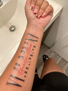 a woman's arm with her name tattooed on it