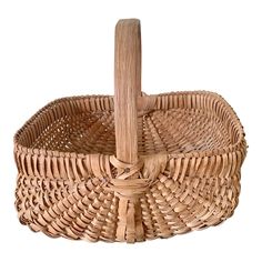 an empty wicker basket with a wooden handle on a white background for text or image