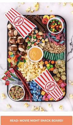 the popcorn movie night snack board is ready to be eaten