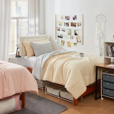 a bedroom with white walls and wooden floors